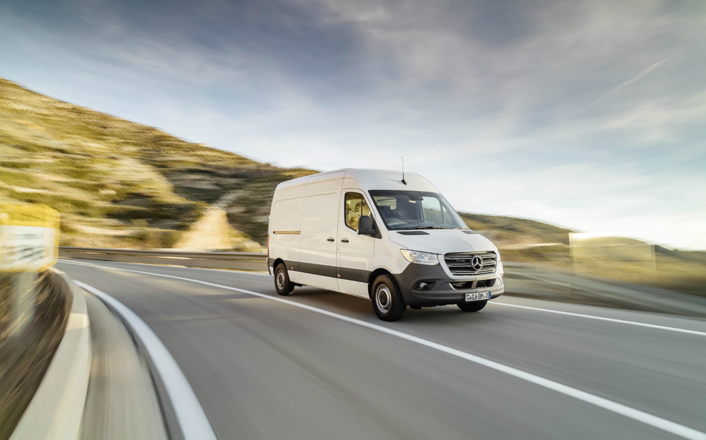 Commercial Sprinter-Van driving on country road