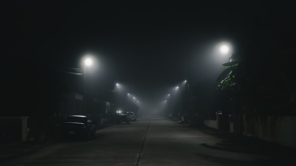 Street night scene with fog background in the village and silent town concept