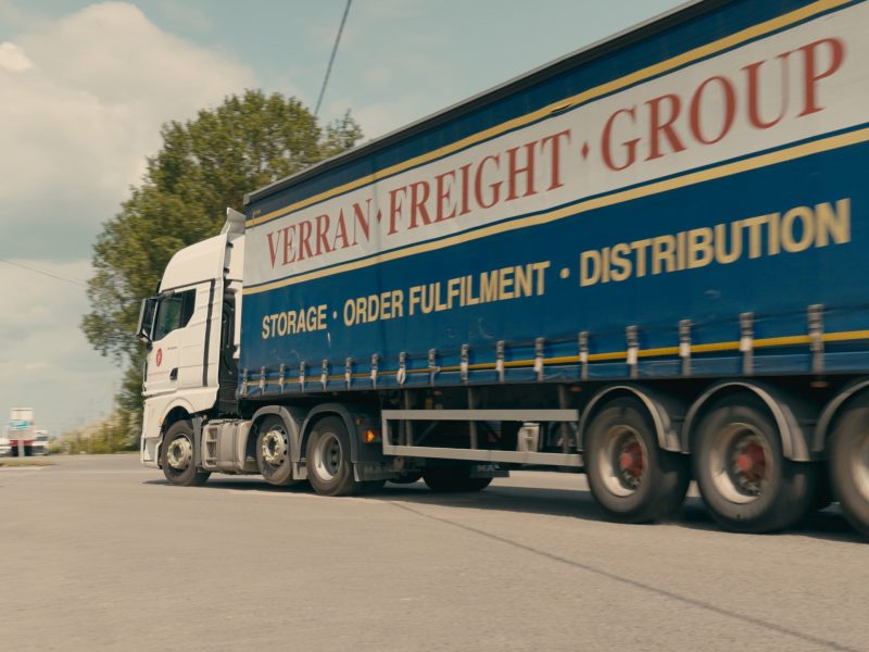 Picture of a Verran Freight truck driving in their yard.